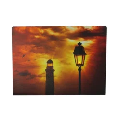 Northlight LED Lighted Lighthouse And Lantern Lamp Post With Amber Sky Canvas Wall Art 15.75" X 11.75"